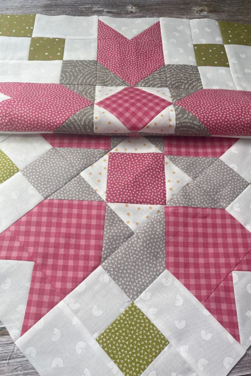 Two coordinating Farmer's Star quilt blocks featuring fabric from Renew and Spring Chicken by Sweetwater in colors green, grey, pink, and white.