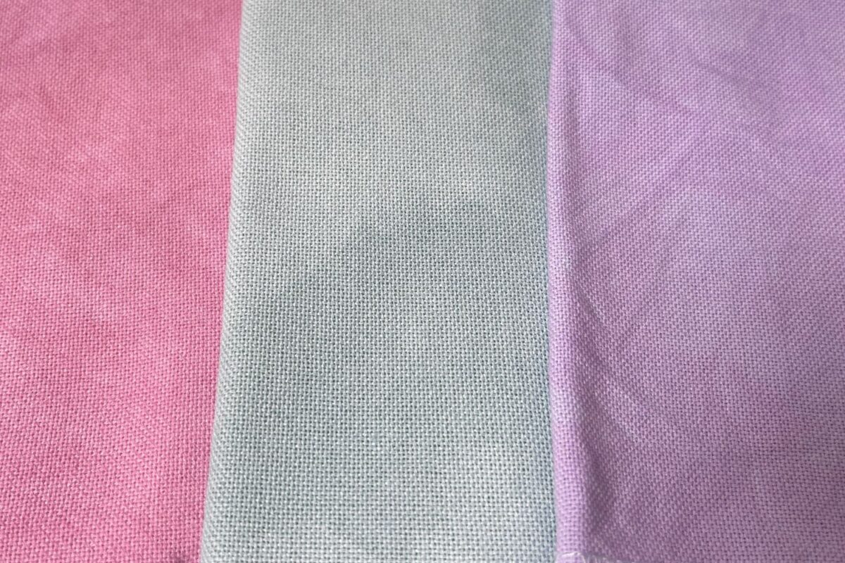 Close up picture of 28 count hand dyed evenweave cross stitch cloth by Colour and Cotton