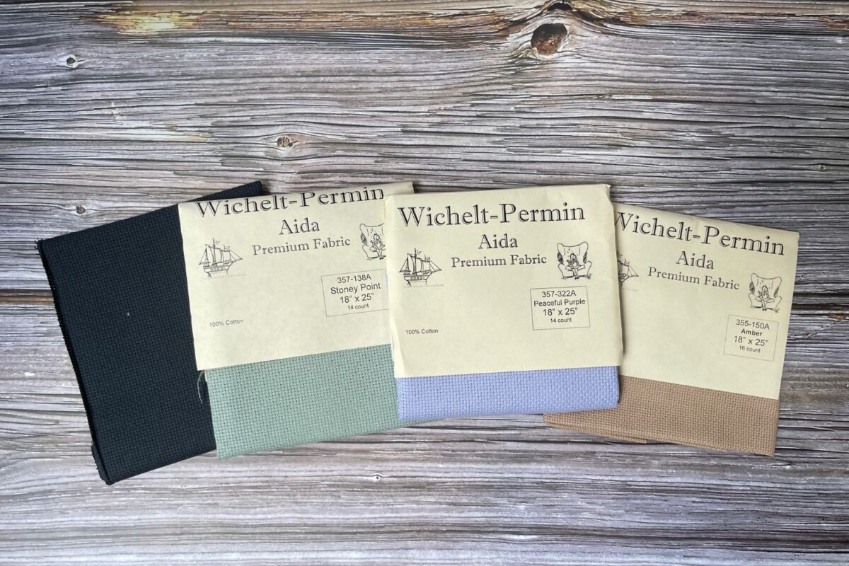 A variety of 14 count and 16 count Aida Cross Stitch Cloth that is all solid color