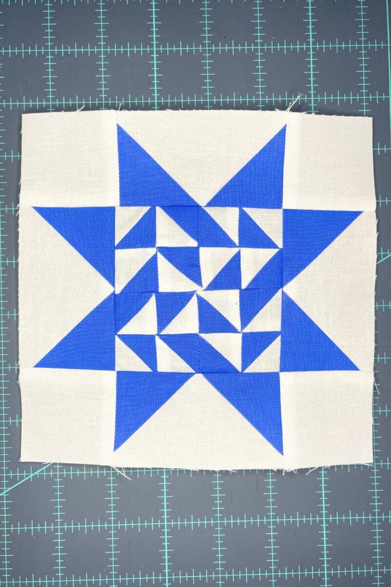 block 23 from the Triangle Gatherings Quilt book. Featuring blue fabric from the Free Spirit Solids collection