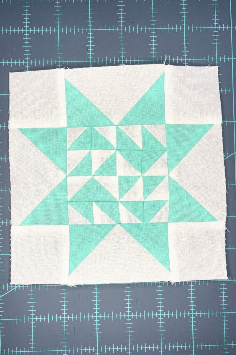 Block 21 from the Triangle Gatherings Quilt Book. Featuring Free Spirit Solids fabric