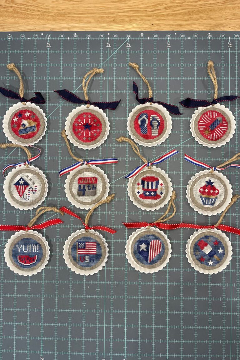 Finished round cross stitch pieces using the Star Spangled Ornaments and tart tins from Fat Quarter Shop.