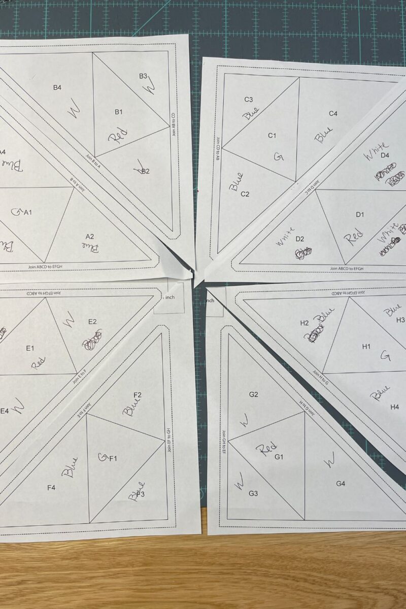 Paper piecing templates labeled with which fabrics will go in which spot