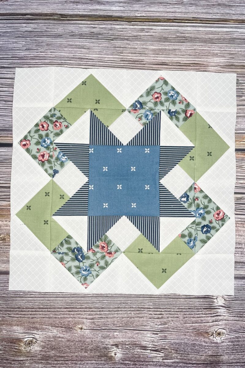 Month 4 of the Designer Mystery quilt along by Fat Quarter Shop. The block is Lily by Corey Yoder. It contains flying gees and double flying geese to make a star block