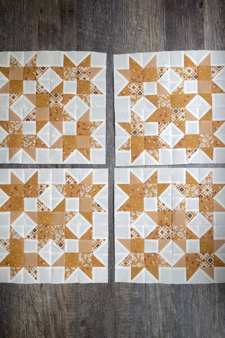 4 yellow and white scrap quilt blocks using Folktale fabrics and the Bonnie's Beehive quilt pattern.