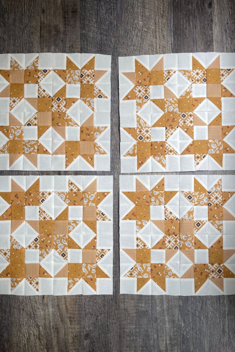 4 yellow and white scrap quilt blocks using Folktale fabrics and the Bonnie's Beehive quilt pattern.