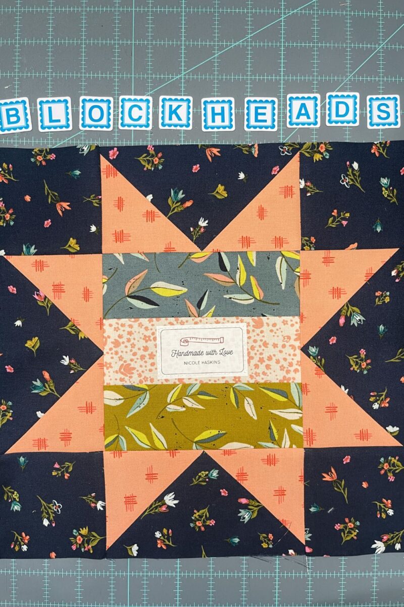 Blockheads bonus signature block. A simple star block with a quilt label in the middle. Made with Songbook Fabrics