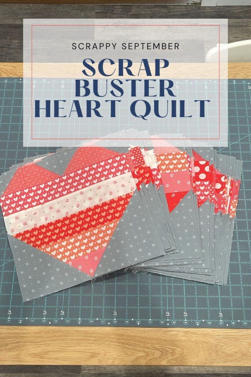 Scrap buster heart quilt for Scrappy September cover photo. Shows the assembled pink, red, and grey heart quilt blocks