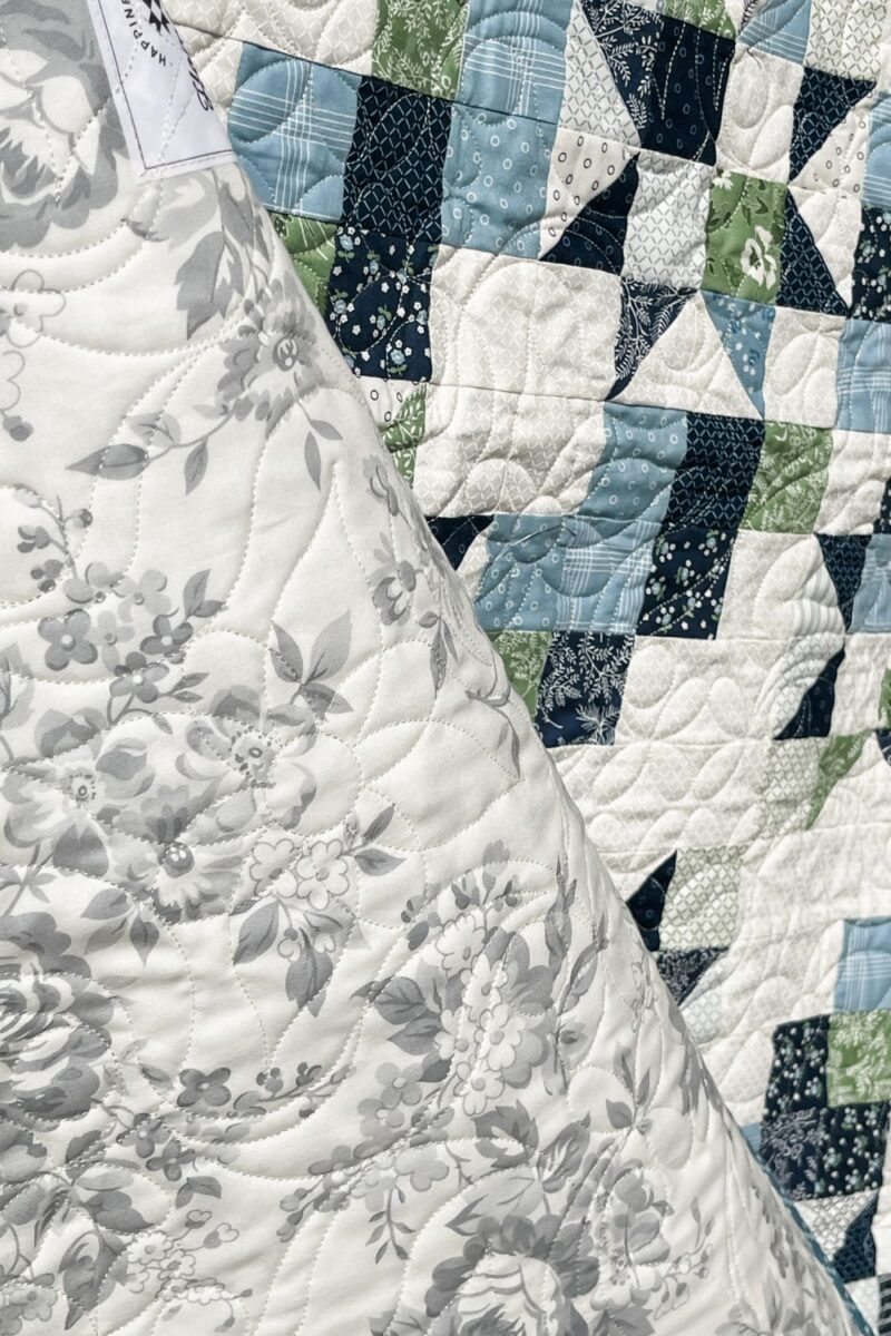 Dwell fabric on the back of the free Star Streams scrap quilt