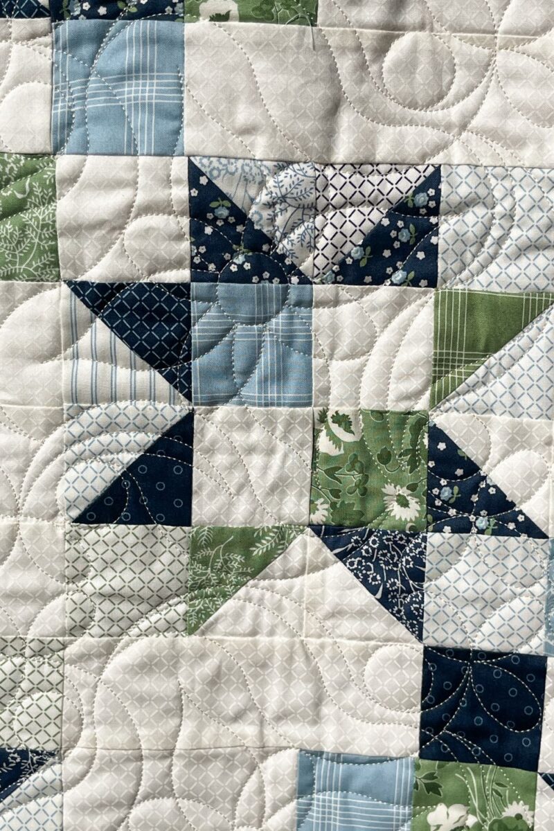 Close up of the long arm quilting on the free Star Streams Scrap quilt.