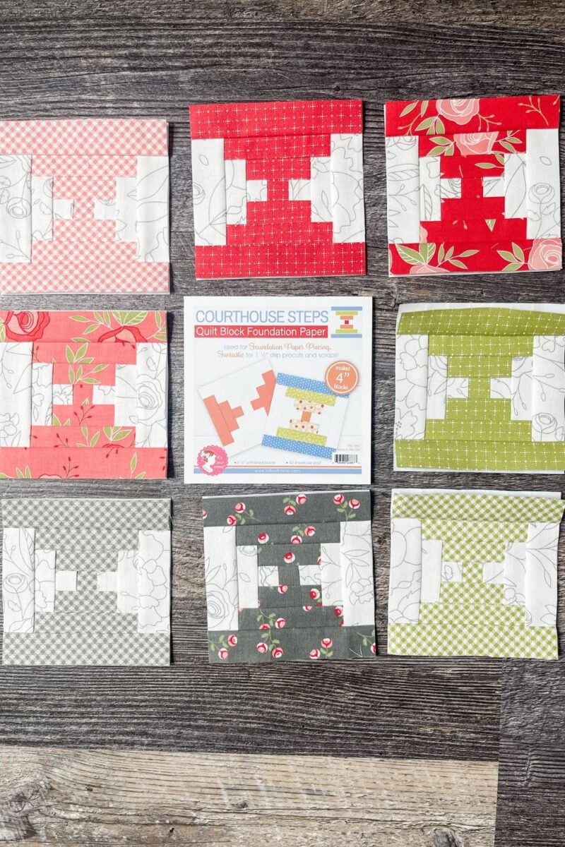 8 foundation paper pieced court house steps quilt blocks pictured with the pad of Courthouse Steps foundation paper.