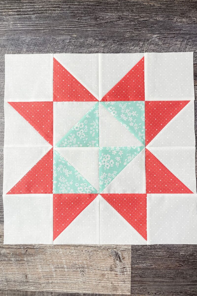Stitch Pink 2023 Block 6 is a four patch block made with teal and white half square triangles and outer star points in dark pink