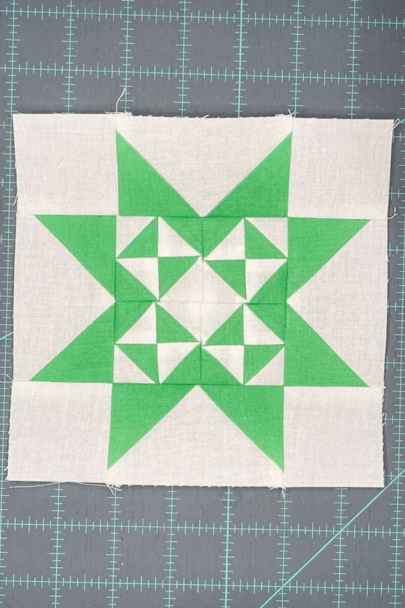 Green and white quilt block using the Triangle Gatherings book