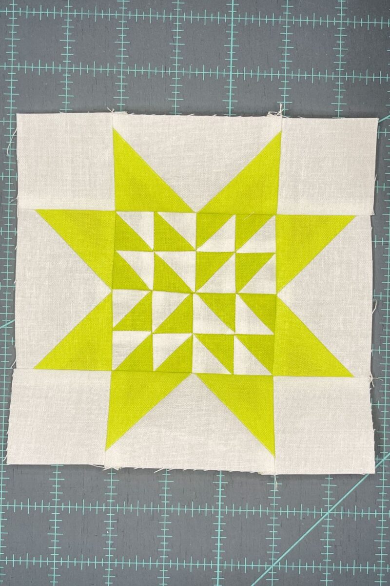Yellow and White quilt block using the Triangle Gatherings quilt book.