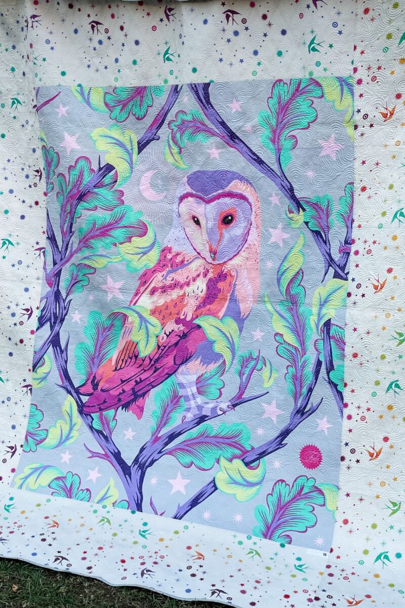 Owl quilt panel on back of quilt.