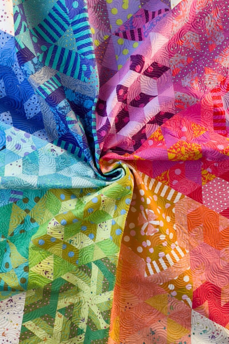 Rainbow swirl of the center quilt blocks of the Nebula quilt.
