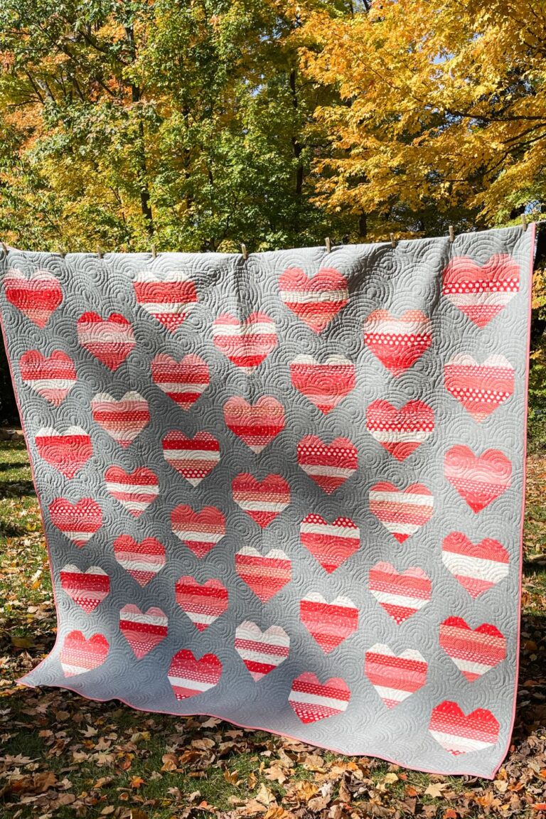 Full quilt of You Have My Heart. Made with scrap fabric and grey Beyond Bella background.