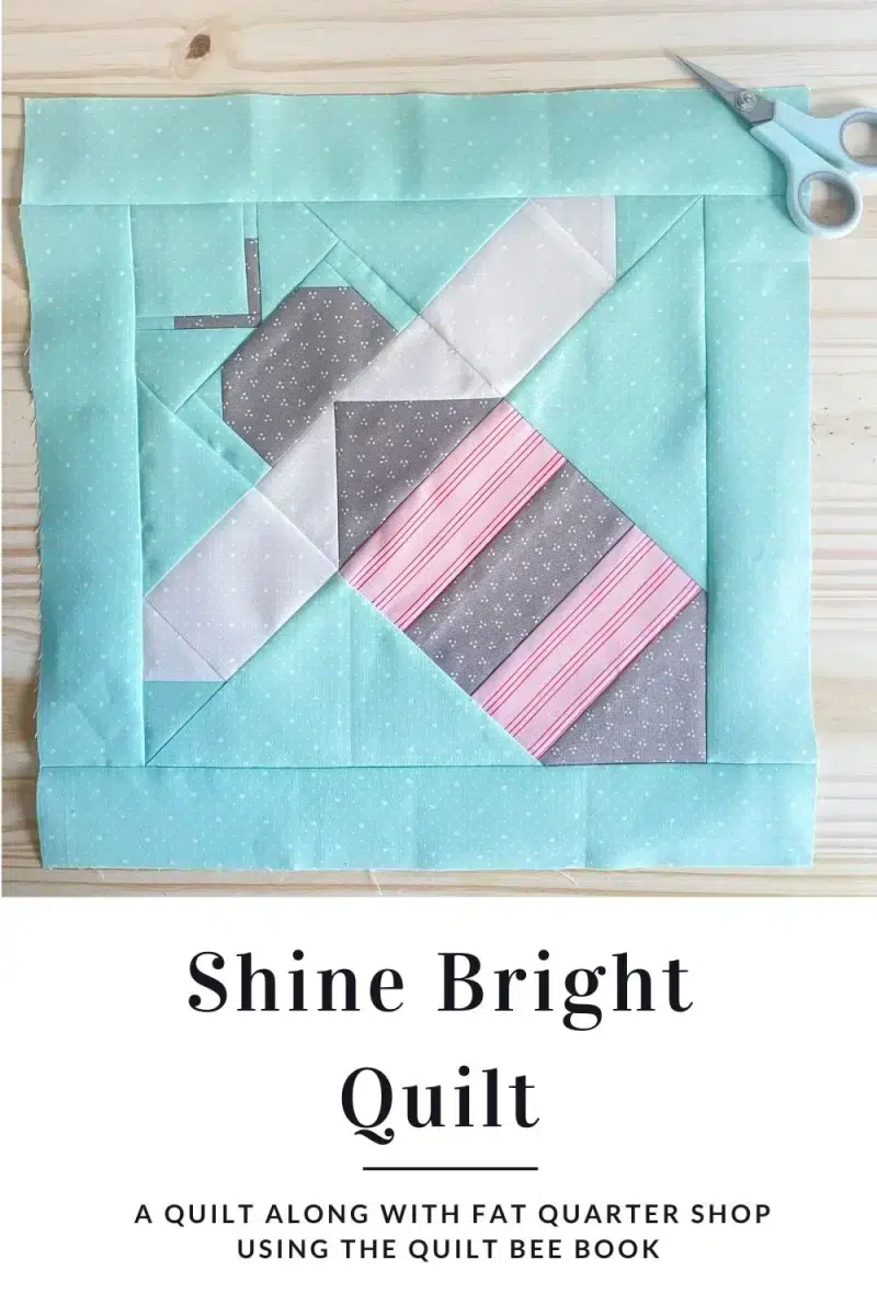 The image shows a quilt block of a bee. It is made with the Lighthearted fabric collection