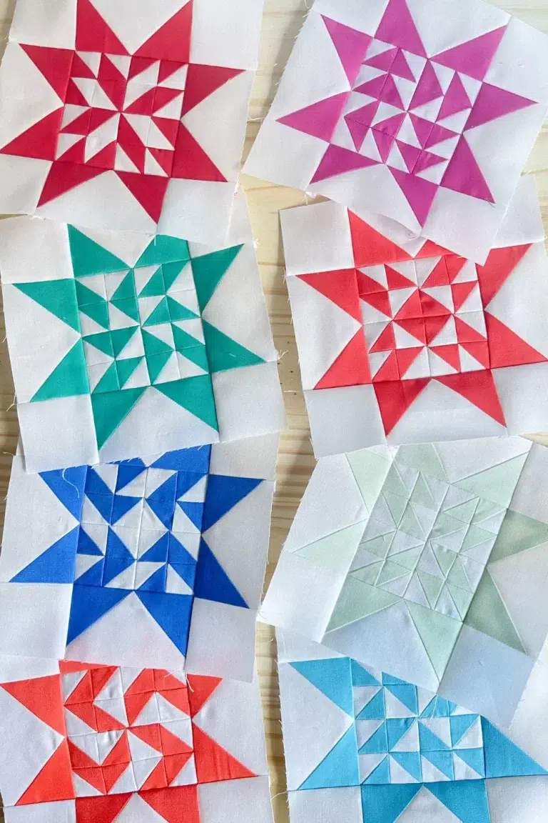 Star quilt blocks in a variety of colors. Made with 16 half square triangles in the center part of the star.