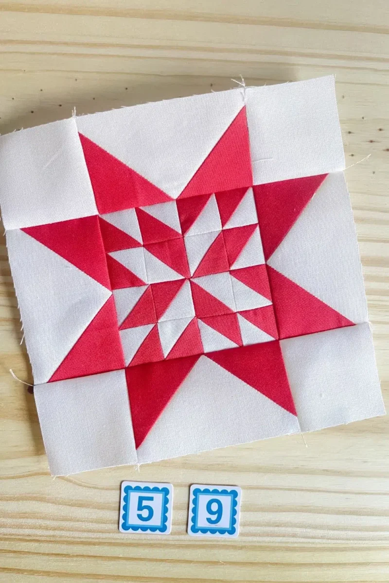 Star quilt block in red and white. Made with 16 half square triangles in the center part of the star.