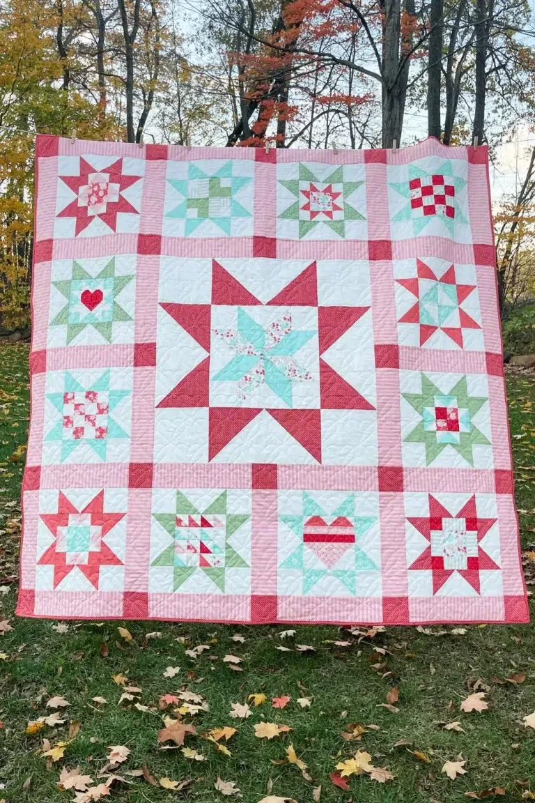 Full Adore Quilt featuring Lighthearted fabrics by Camille Roskelley. This is a 13 block quilt with one large center block that is surrounded by 12 large star blocks.