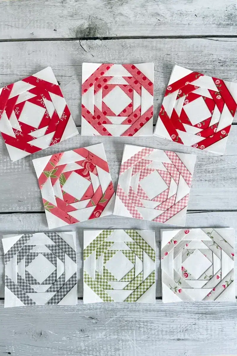 8 pineapple quilt blocks arranged on a table