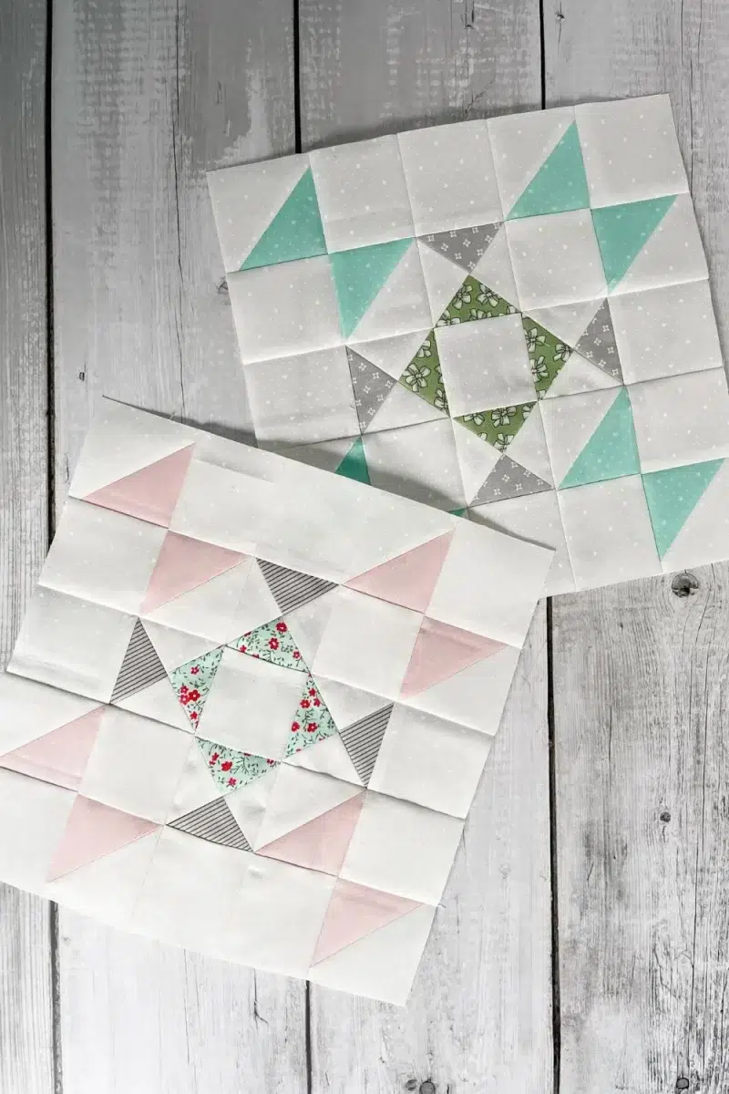 2 quilt blocks in pink/white and aqua/white. Two star blocks.