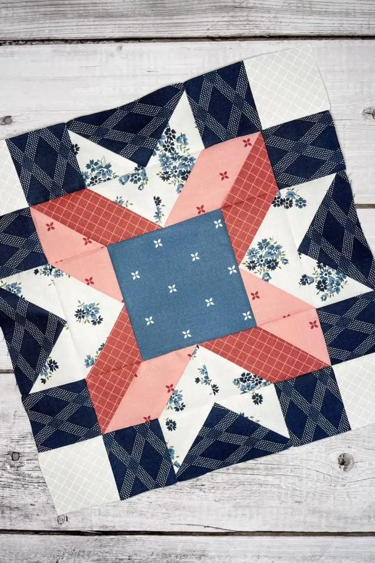 A star block made with Sunnyside fabrics in pinks, blues, and white.