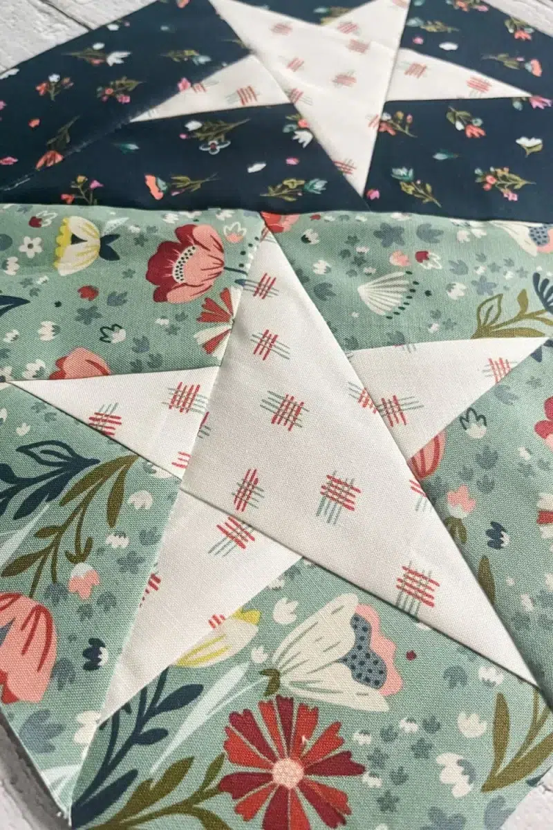 Close up of one of the stars in the lighter aqua half of the quilt block