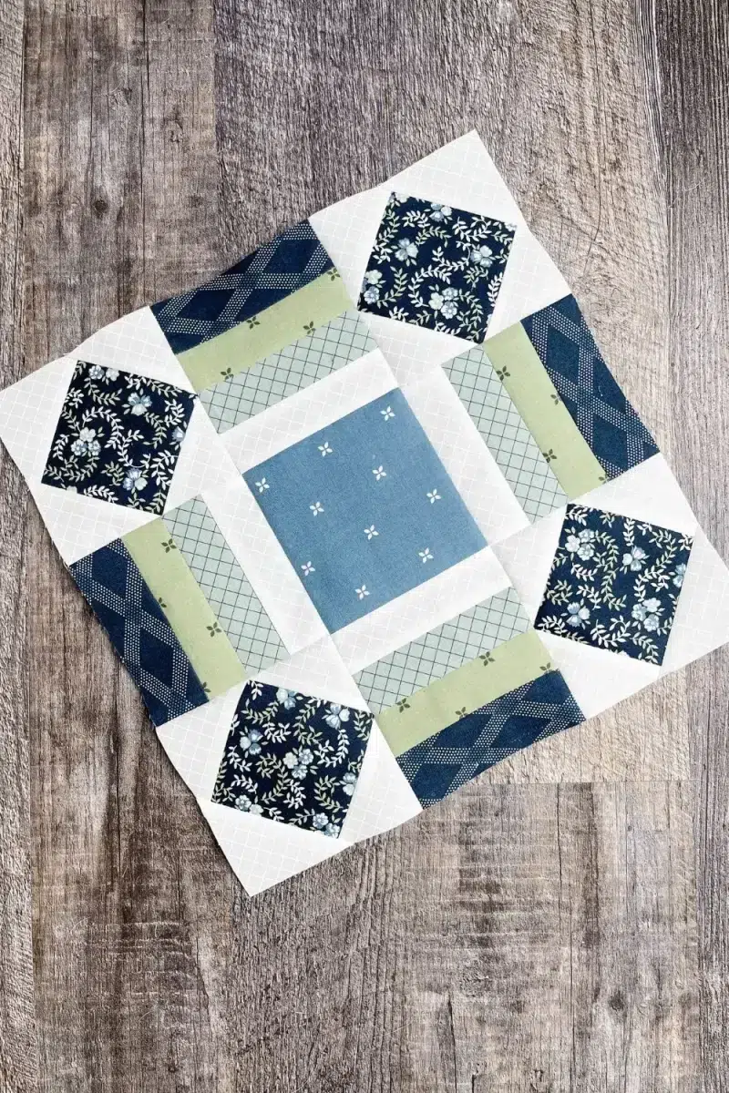 The Sunflower block in 12 inch size using navy, green, blue and white fabrics