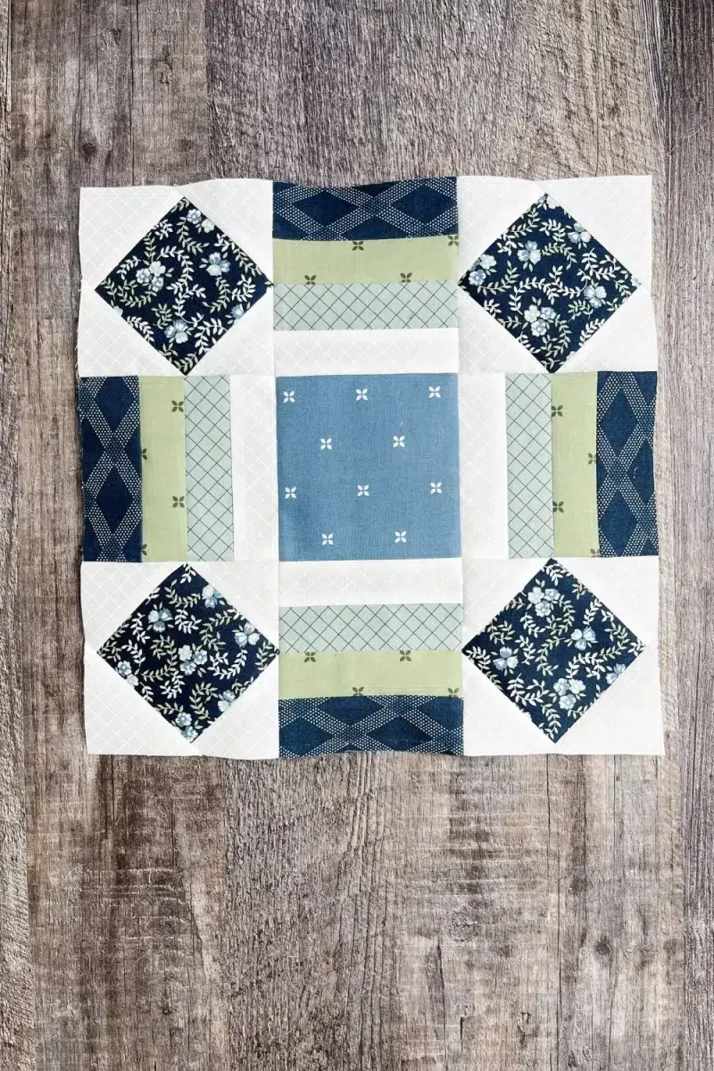 Sunflower quilt block in Sunnyside fabric collection. Uses square in a square and rail fence components.