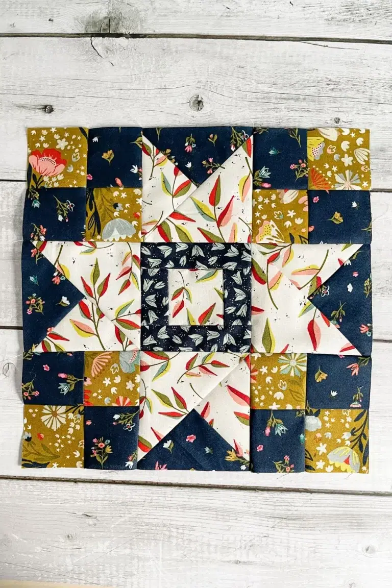 Overhead view of Moda Blockheads 5 Group 2 Block 3. A quilt block called the Shimmer Star. It is made with Songbook fabrics by Fancy That Design House.