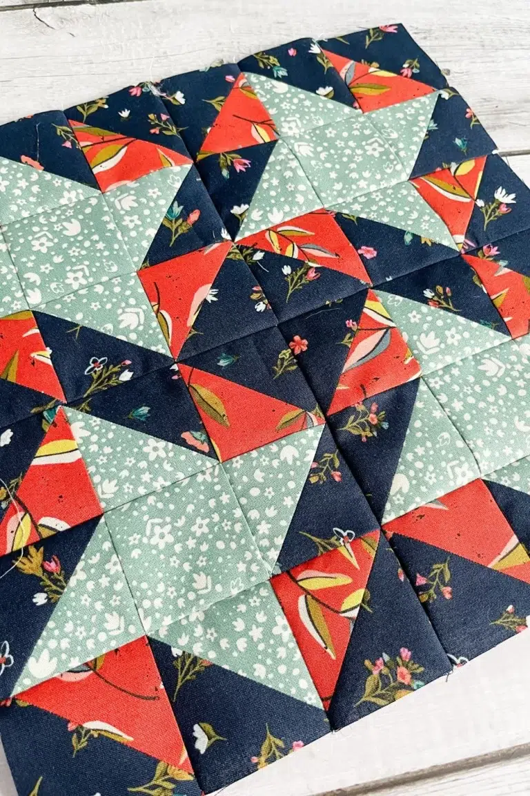 Moda Blockheads 5 group 2 block 2 shown up close at an angle. The All Stars block made with Fancy That Design House's fabric collection Songbook.