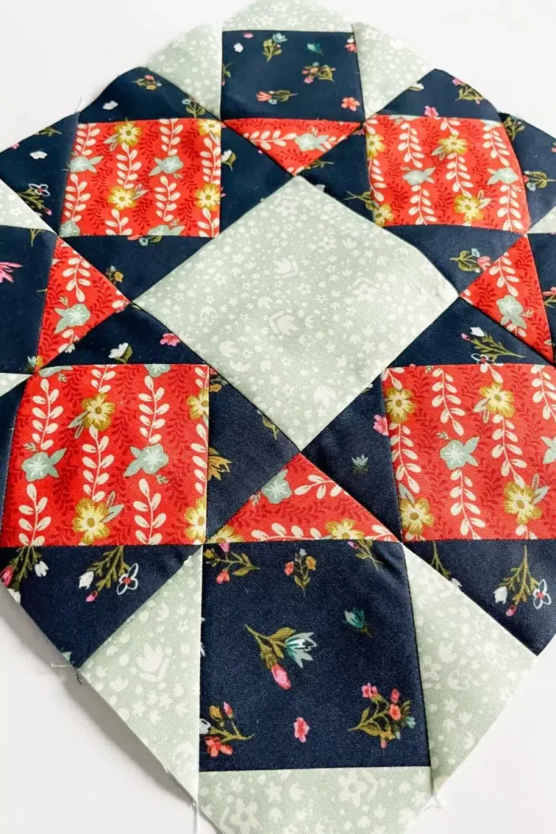 Star Bloom quilt block made with square in a square blocks in a 9 patch arrangement