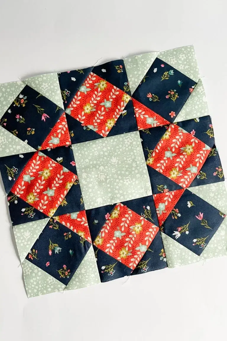 Star Bloom quilt block made with square in a square blocks in a 9 patch arrangement