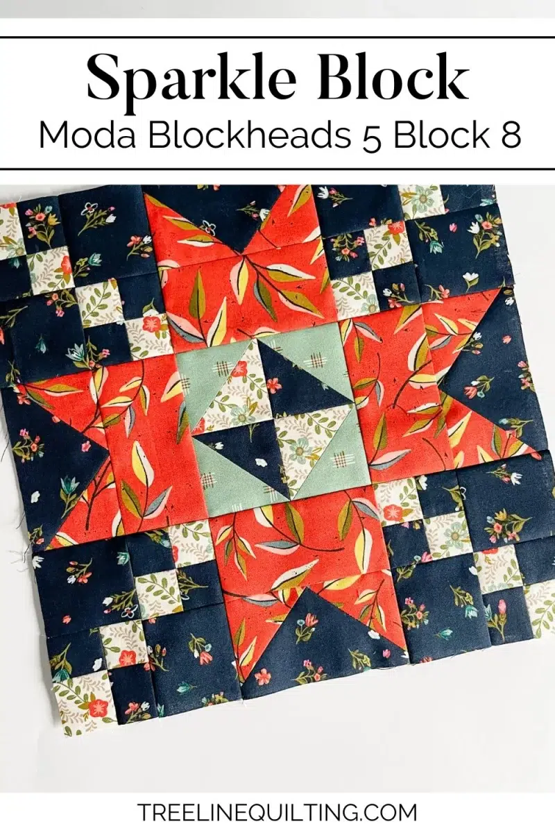 Sparkle quilt block in red, sage, navy, and white florals quilting fabrics.