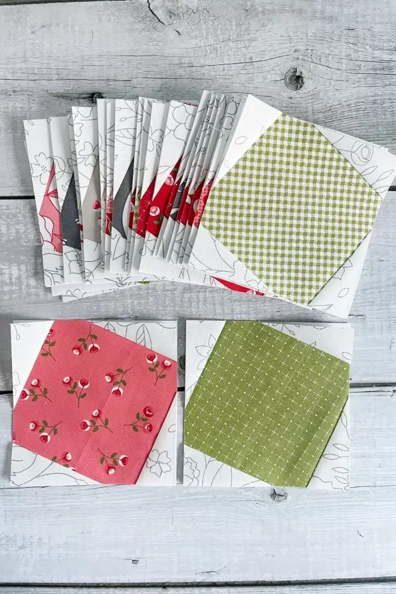 Stack of Sparkle Star quilt blocks and two blocks in foreground to show diagonal corner pieces that make star points