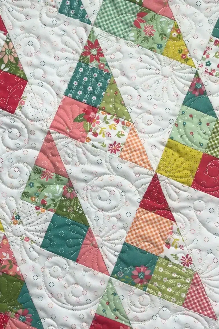 Angled view of the mini charm quilt.