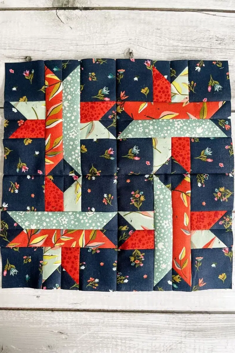 The Shooting Star block is made up of 4 smaller stars using criss crossing strips of fabric with sew and flip corners.