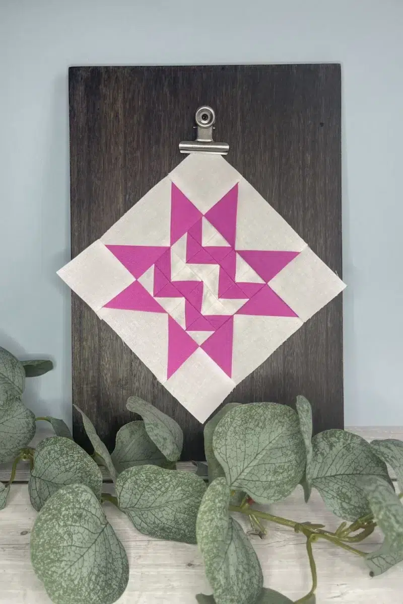 Triangle Gatherings book pattern 82 in white and magenta fabrics.