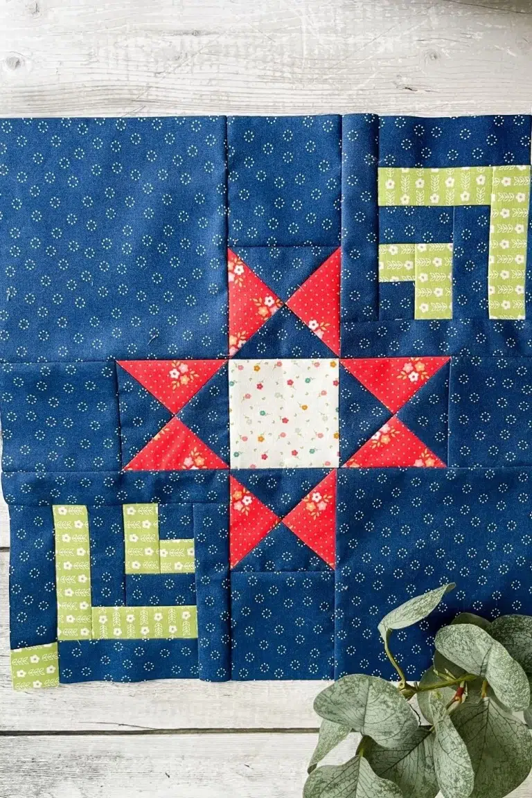 Moonbeams quilt along month 2, the Ohio Star block made with Strawberry Lemonade fabric collection in navy, green, red, and white