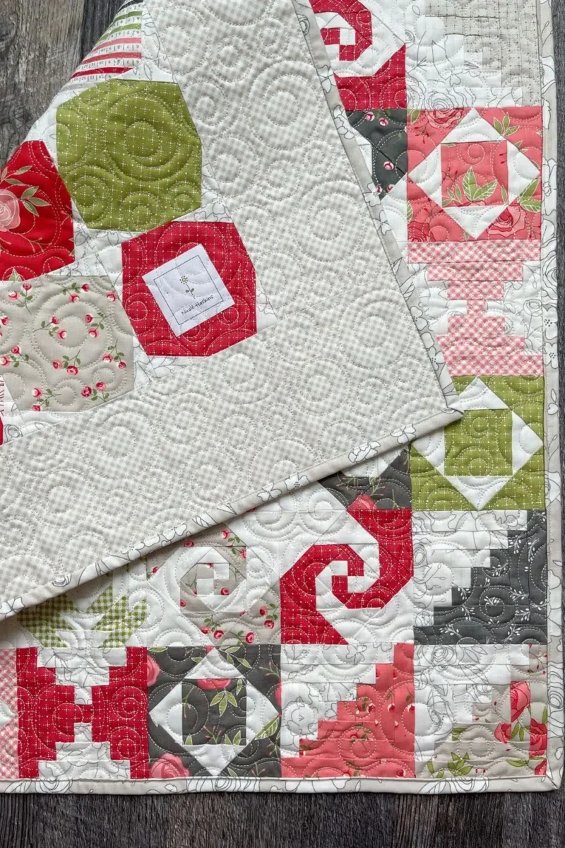 Back of the Petit Four quilt folded over the front of the finished quilt.