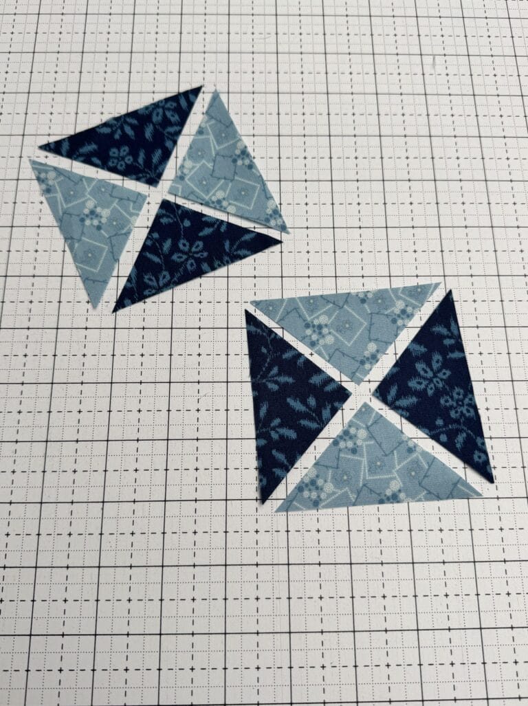 Two fabric squares are cut twice on the diagonal and rearranged to give two hourglass blocks with contrasting fabrics.