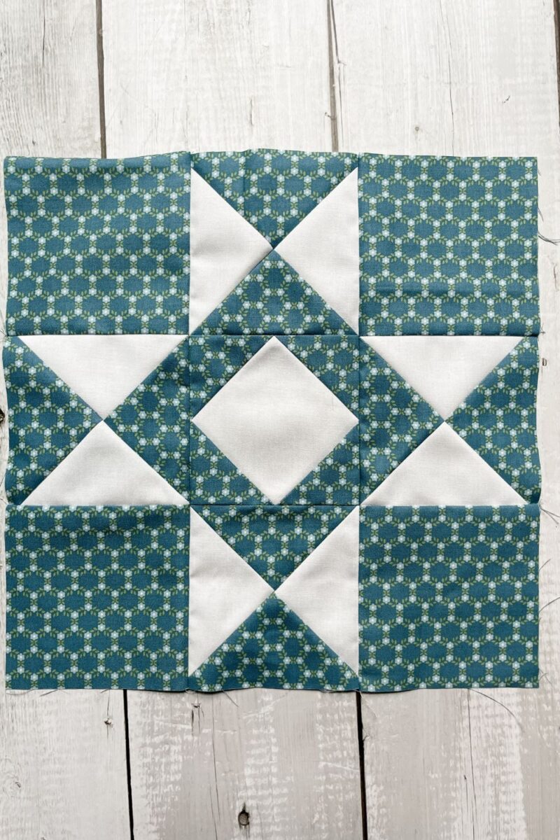 A blue and white Album Star quilt block made with the Dwell fabric collection.