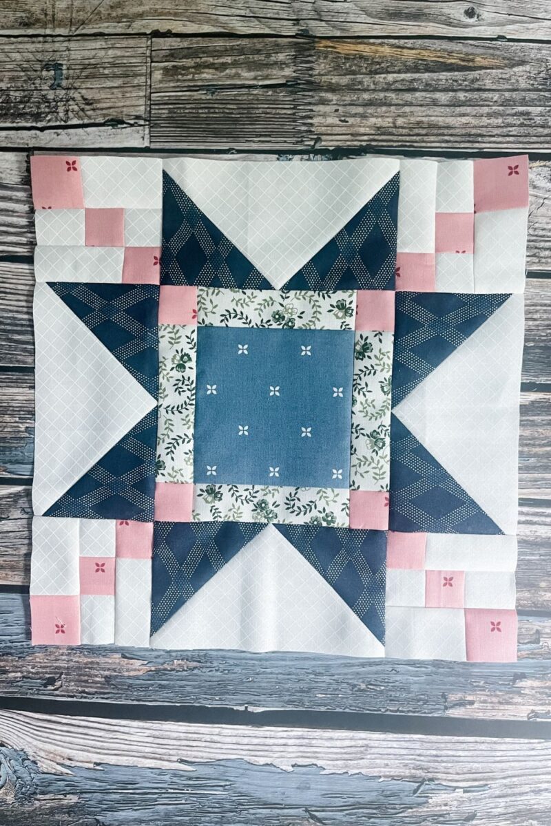 The Aster quilt block designed by Lisa Bongean for the 2023 Designer Mystery quilt along with Fat Quarter Shop