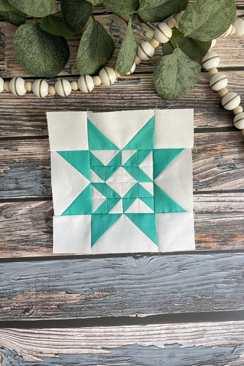 Twilight stars quilt block 39 in teal and white
