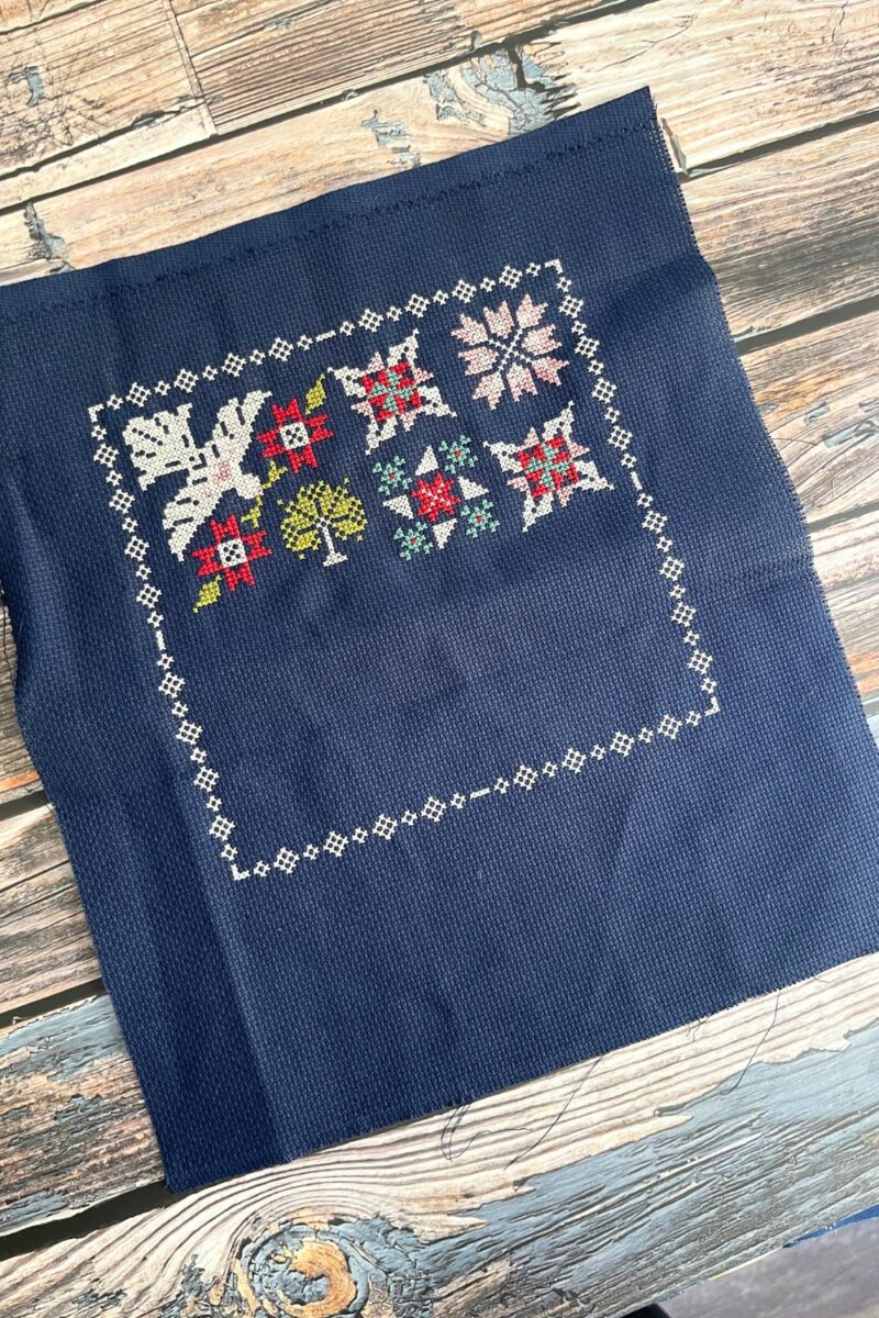 Moonbeams month 3 cross stitch progress of dove, flower, star, and tree images.