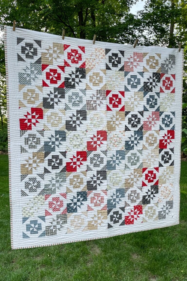 Twist and Turn quilt made with Freedom layer cake by Sweetwater.