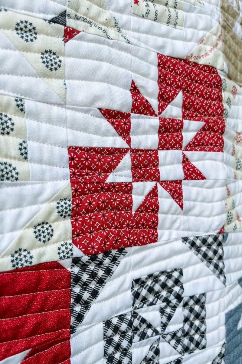 Close up angle view of the longarm quilting on the Twist and Turn quilt.