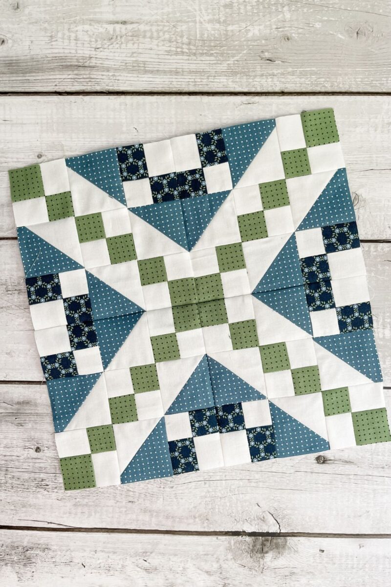 4 Wagon Tracks quilt blocks sewn together to make one large quilt block.